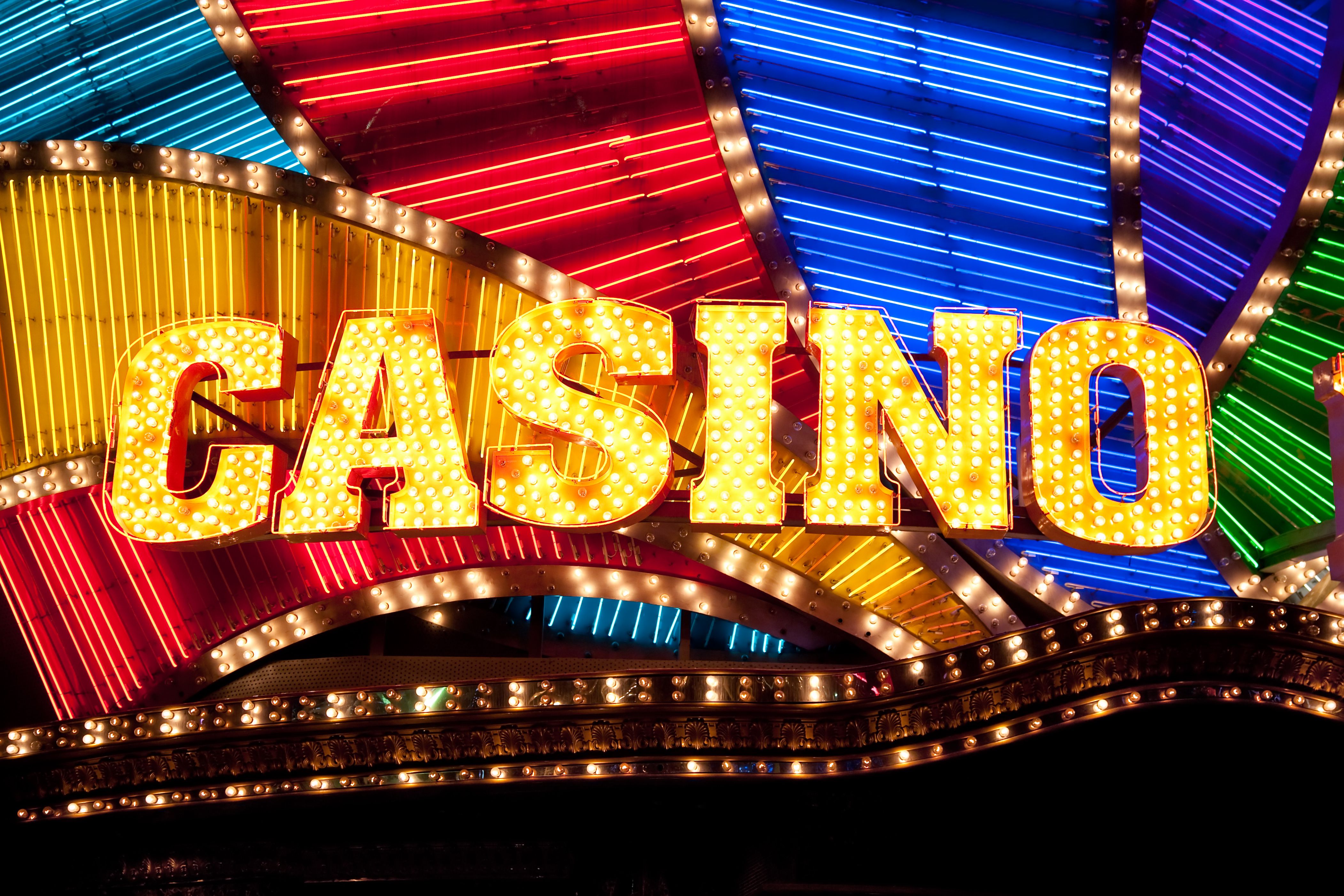 A stunning photo of a Swiss casino like Grand Casino Baden or Casino de Montreux against a scenic backdrop.
